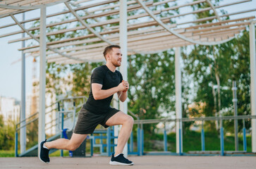 Man confidently lunges outdoors, exuding energy and determination amid a relaxing park setting under clear skies.