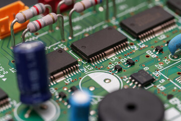 Circuit board symphony of resistors, chips, and capacitors in green