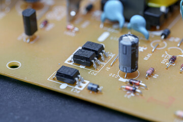 Exploring the intricate landscape of a printed circuit board with miniature electronic components...