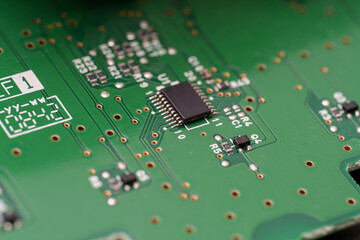 Upon a circuit board, small electrical components form the backbone of modern technology