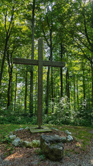 View of the place to give respect to the dead in the forest cemetery Friedwald in Germany. Vertical format.