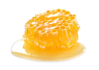 Honeycomb with honey on white background
