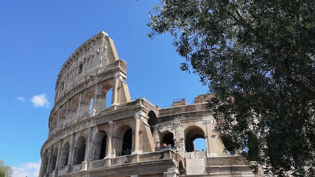 Sightseeing of facade of famous landmark Coliseum or Flavian Amphitheatre, Amphitheatrum Flavium or Colosseo, Rome, Italy