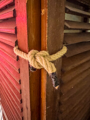 Strong Rope Knot on Wooden Shutters Rustic Detail and Texture