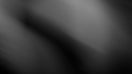 Abstract blurred grainy black and white, light gray and black diagonal spots.