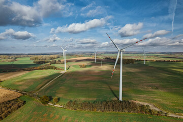 Wind turbines on agricultural landscape from above