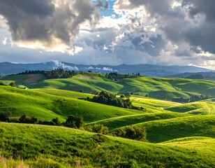 Rolling green hills bask in sunlight beneath dramatic, cloud-filled sky. Shadows and light create a dynamic, picturesque landscape