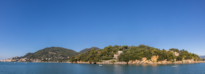 Panoramic view of the Ligurian coast and the colorful villages of Cinque Terre as seen from the sea on a cruise ship on a clear day. Cinque Terre, Liguria, Italy