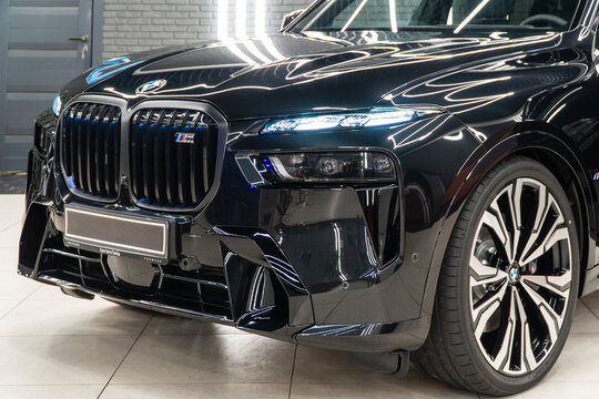 Black BMW X7 G07 M60i xDrive in showroom, luxury car exterior. Vehicle exterior SUV car. The modern exterior of a premium Germany SUV BMW X7 M60i xDrive 6-seater. 