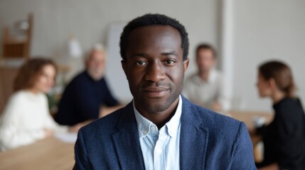 Focused African male executive exudes leadership during brainstorming session, evoking Juneteenth unity and International Men's Day empowerment