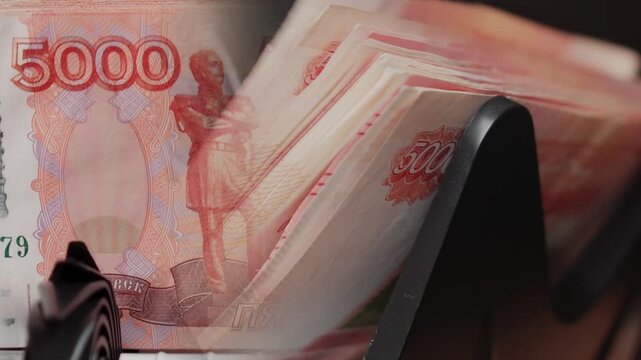Double-exposure video of Russian ruble banknotes in a counting machine with overlapping money layers symbolizing cash flow, finance, wealth, abundance, and economic power