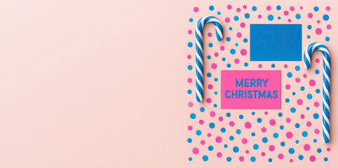 Merry Christmas card with candy canes and round confetti