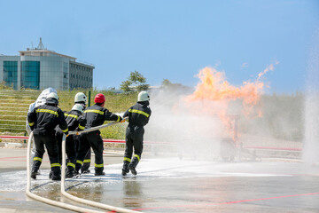 Fire extinguishing drill. Workplace workers conduct fire drills. 