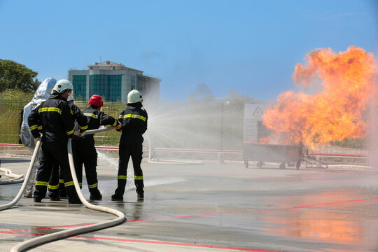 Fire extinguishing drill. Workplace workers conduct fire drills. 