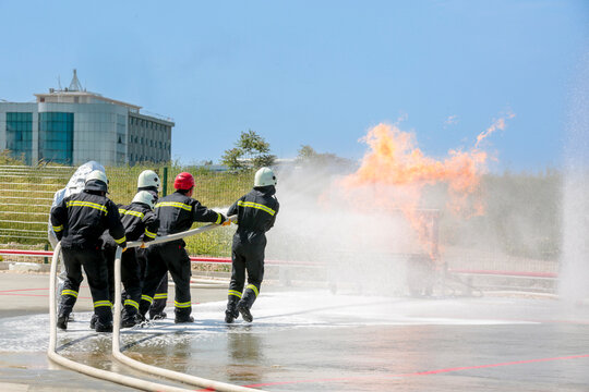 Fire extinguishing drill. Workplace workers conduct fire drills. 
