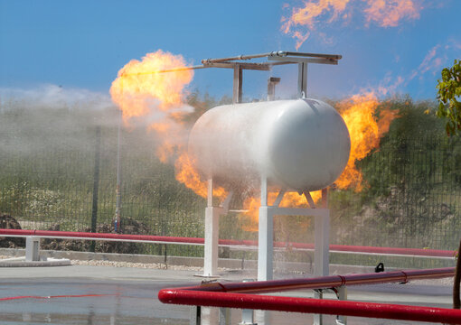Fire extinguishing drill. Workplace workers conduct fire drills. 