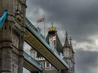 Stunning aerial view of Tower Bridge in London, spanning the River Thames with the city skyline in the background &mdash; blending historic architecture and modern urban beauty. London Bridge