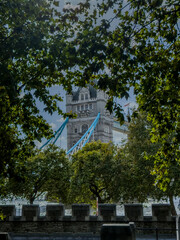 Stunning aerial view of Tower Bridge in London, spanning the River Thames with the city skyline in the background &mdash; blending historic architecture and modern urban beauty. London Bridge