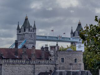 Stunning aerial view of Tower Bridge in London, spanning the River Thames with the city skyline in the background &mdash; blending historic architecture and modern urban beauty. London Bridge