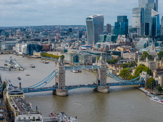Stunning aerial view of Tower Bridge in London, spanning the River Thames with the city skyline in...