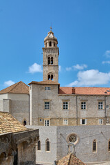 Obraz premium The Franciscan Monastery bell tower and rooftops in Dubrovnik