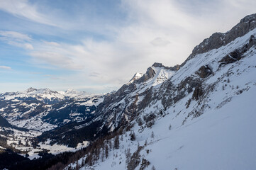 Fototapeta premium Winter Landscape of Snow-Covered Mountains and Alpine Valley. Les Diablerets Region, Swiss Alps, Switzerland