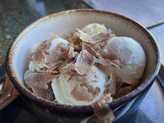 A special ice cream recipe served with thinly sliced white Alba truffles.