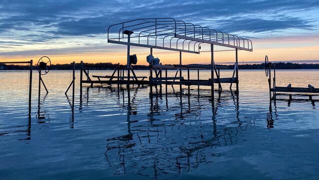 Colorful Sunset Over Lake with Boat Lifts in the Fall
