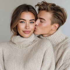 Couple enjoying a cozy moment in matching sweaters at home