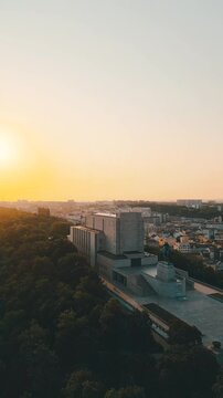 Experience the stunning sunrise illuminating the Vitkov National Monument in Prague. This iconic site features the impressive statue of Jan Žižka on a picturesque hilltop.