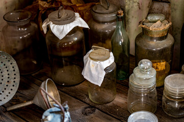 Vintage Glass Jars and Ceramic Containers in Rustic Kitchen Storage Collection
