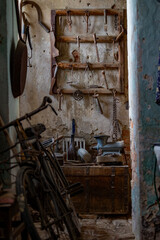 Vintage Rustic Workshop Interior with Antique Tools and Weathered Wooden Shelves