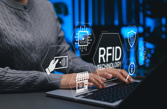 RFID Radio Frequency Identification Concept. Person using laptop with RFID technology, secure contactless systems, retail automation, data tracking, smart retail, inventory management, access systems, - Powered by Adobe