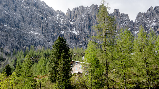 Rustic cabin nestled in the majestic Dolomiti mountains - Powered by Adobe