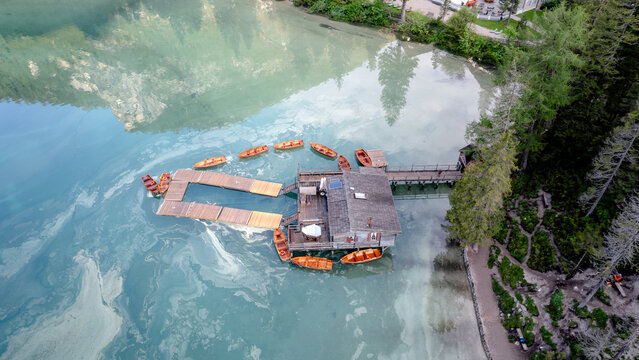 Scenic view of Lago di Braies with boats and dock