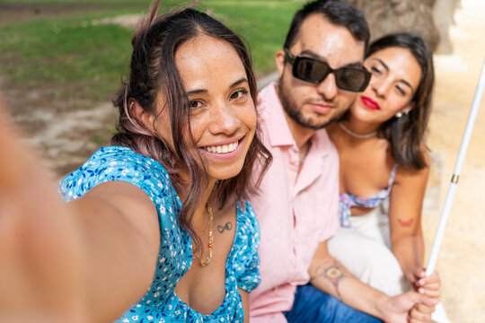 Friends taking a selfie promoting inclusion and friendship