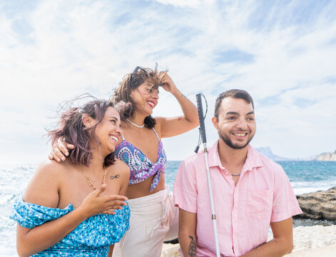 Friends enjoying a beach day promoting inclusion