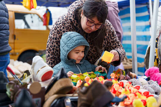 Mother and child exploring toy market in Chile