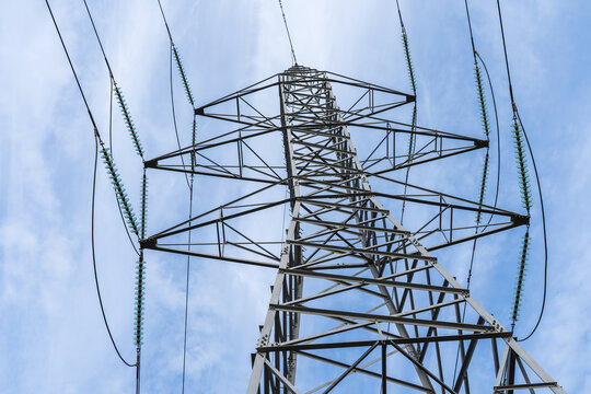 Power line tower against clear blue sky