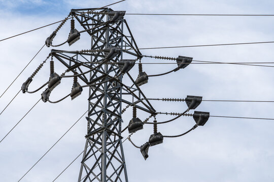 High voltage transmission tower against the sky