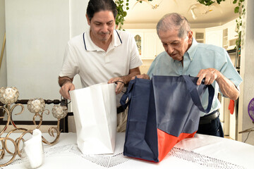 Father and son of Latin descent enjoying shopping together