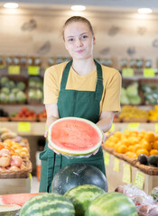 Grocery store saleswoman offers to buy a ripe watermelon