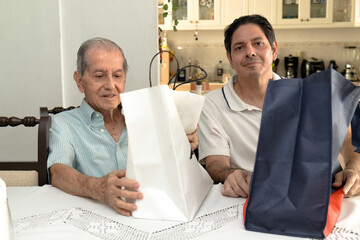 Father and son of Latin descent enjoying shopping together