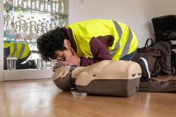 First aid training with CPR practice on mannequin
