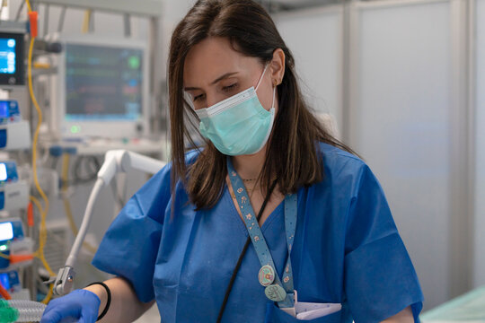 Nurse working diligently in a modern ICU setting