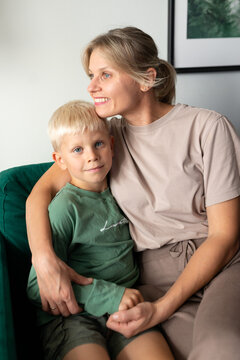 Mother and son sharing a warm embrace at home