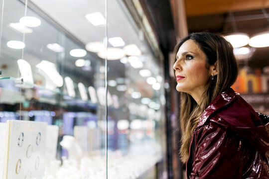 Woman admiring display at a supermarket
