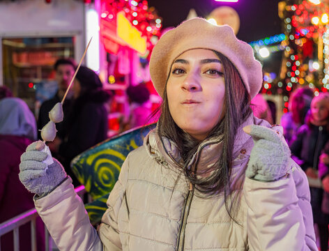 Girl enjoying festive winter in Paris night market