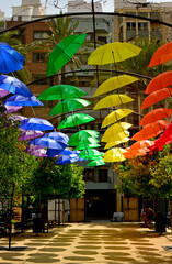 kolorowe parasole wiszące w mieście podczas parady równości, symbol LGBT, Colorful decorative umbrellas, rainbow umbrellas hanging around the city during the pride parade, lgbt umbrellas  © kateej