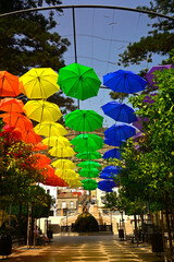 kolorowe parasole wiszące w mieście podczas parady równości, symbol LGBT, Colorful decorative umbrellas, rainbow umbrellas hanging around the city during the pride parade, lgbt umbrellas  © kateej